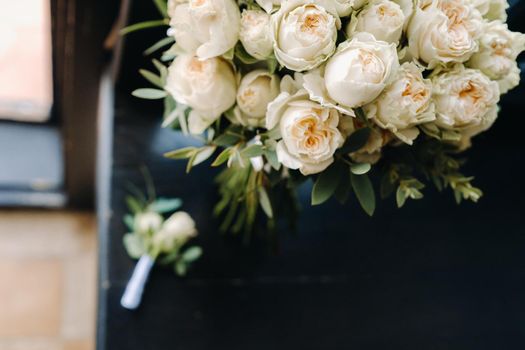 Wedding bouquet of roses lying on the surface. Wedding floristry