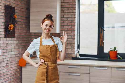 cheerful woman houses in the kitchen apartments home life