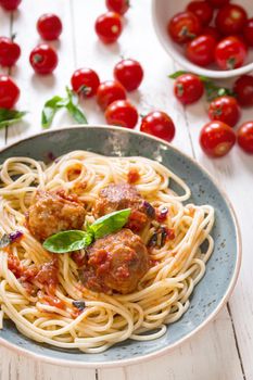 Spaghetti with meatballs and tomato sauce on a plate