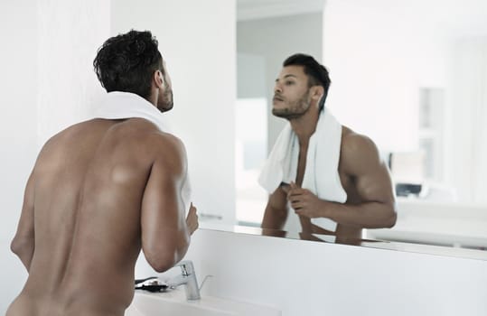Like the man looking back at you in the mirror. Shot of a naked man standing in his bathroom.