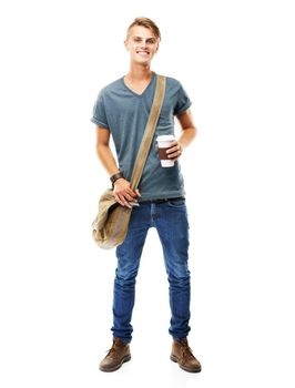 The java keeps me going. A full length studio shot of a young man carying a messengers bag and holding a cup of coffee isolated on white.