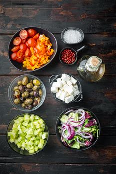 Ingredients for greek salad, on old dark wooden table background, top view flat lay