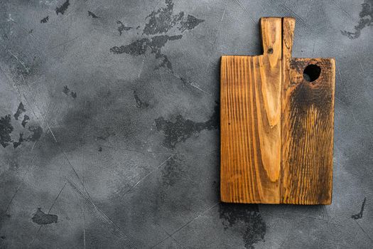 Scratched chopping board, top view flat lay , with copy space for text or food, on gray stone table background