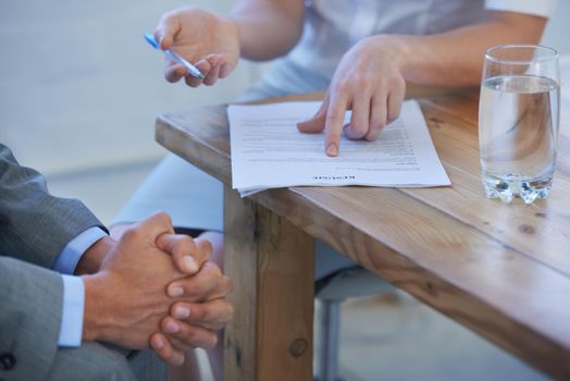 Deciding on a job candidate. Cropped image of two businesspeople discussing a resume.