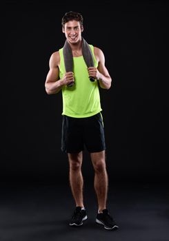 Time to break a sweat. Studio shot of a handsome young man in sportswear.