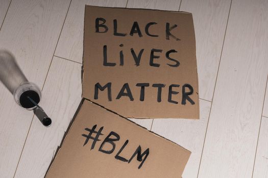 Black lives matter and fight against racism and write sign and words on cardboard - protest concept and blm activism