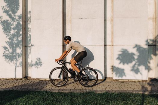 Caucasian man in sportswear enjoying outdoors cycling