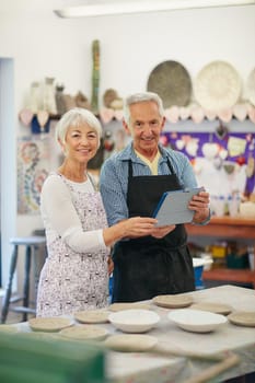 Our online pottery business is now live. Shot of a senior couple working with ceramics in a workshop.