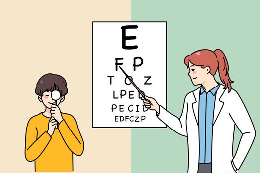 Female ophthalmologist check eyesight of boy child