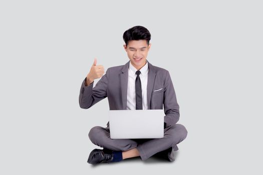 Young asian business man sitting work on laptop computer to internet online isolated on white background, businessman confident and notebook, freelance with success, marketing and communication.