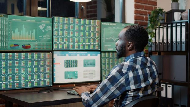 Hedge fund trader analyzing exchange market charts and graphs