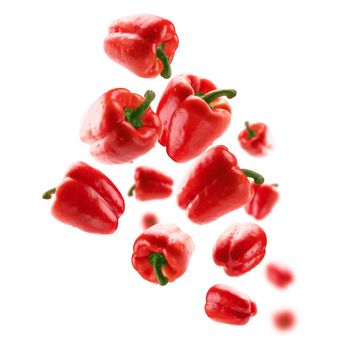 Red paprika levitates on a white background