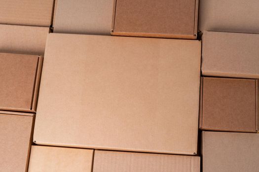 Cardboard boxes stacked in a pile as a background