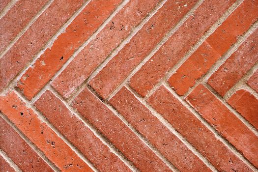 Wall made of diagonal red clinker bricks