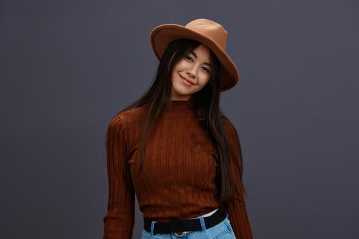 woman brown hat hand gestures brown sweater fashion emotions isolated background