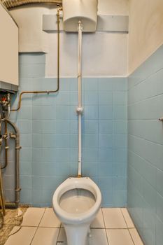 A small, old-fashioned toilet