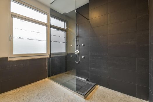 Modern shower cabin with glass door