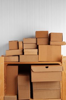 Stack of cardboard package boxes on wooden rack