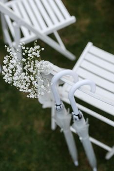 white wooden chairs for wedding ceremony