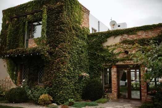 villa red brick restaurant overgrown