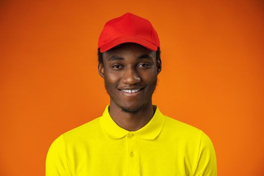 Handsome smiling young african man standing in studio