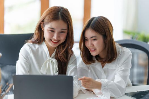 Two girl watching content on laptop computer. Youth, lifestyle, communication concept.