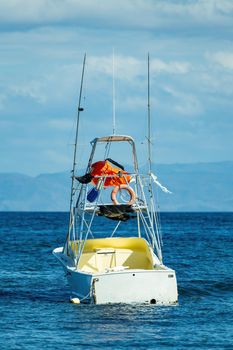 Motor boat anchored on Ocotal beach, Pacific ocean, El Coco Costa Rica