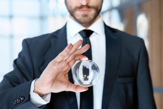 close-up. businessman showing a glass globe . business concept.
