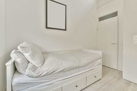 A small bedroom with a single bed