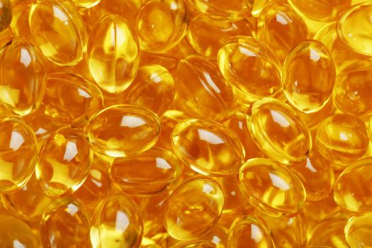 Background of capsules in a shell with vitamin Omega 3 Fish oil