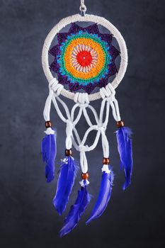 Amulet Dreamcatcher on a black background close-up protecting the sleeper from evil spirits