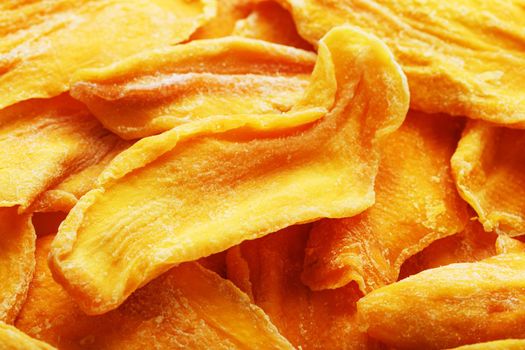 Dried sweet mango fruit slices as textural orange