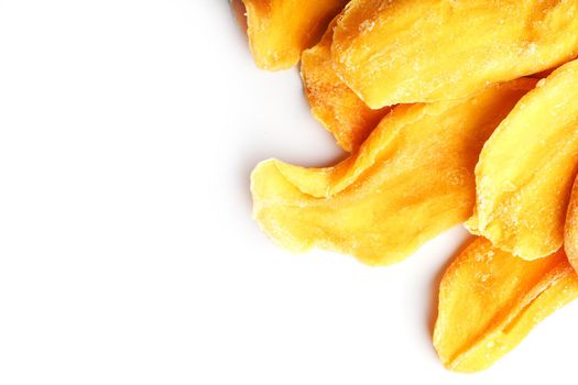 Dried mango sliced on a white background with free space