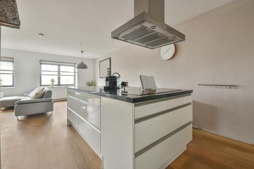 A small corner kitchen in white tones