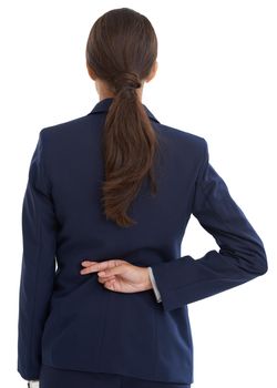 Going back on her word. Rear view shot of a businesswoman with her fingers crossed behind her back in studio.