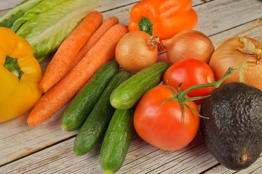 High Angle View of Selection of Fresh Summer Vegetables on a Rustic Wooden Table