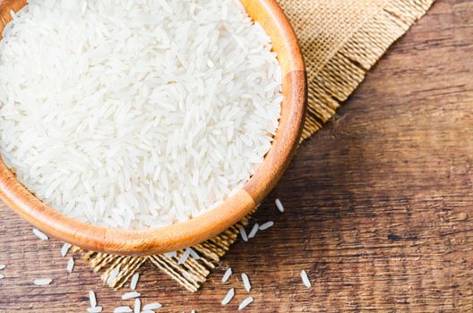 Rice in a bowl on wooden table