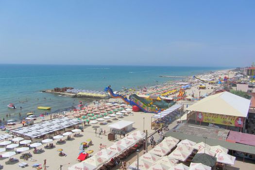 An aerial view of the beach and resort restaurants on a sunny day. Ukraine, Iron Port, 21 July 2021