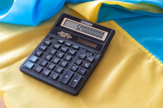 flag of Ukraine, a calculator. Economic crisis concept