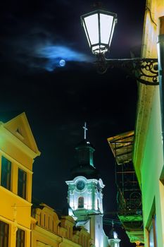Old European church in full moon night
