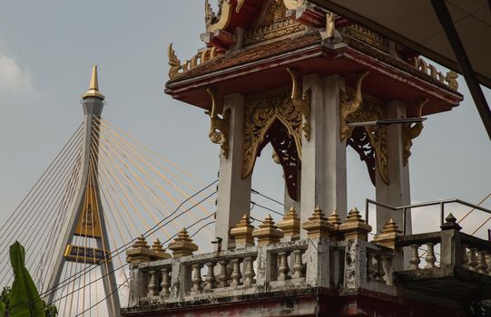 Bangkok, Thailand. Mar - 12, 2022 : Beautiful view of Buddhist thai temple with suspension bridge can coexist perfectly. No focus, specifically.
