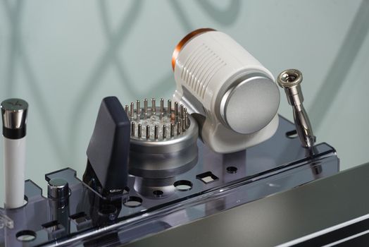 Part of a modern device for needle free mesotherapy in a clinic