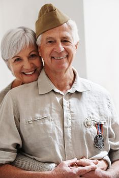 He still looks so handsome in his uniform. Cropped shot of a senior war veteran and his wife.