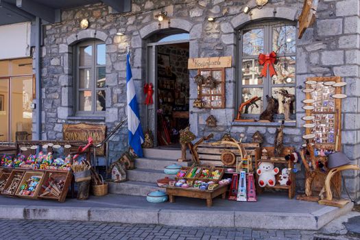 Vytina, Greece - February 25 2022: Outdoor showcase day view of gifts and souvenirs Greek shop in Arcadia, Peloponnese.