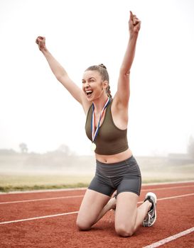 The right attitude will get you far. Shot of a young female athlete celebrating her run.