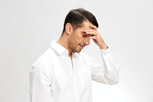 handsome businessman holding his head in white shirts headache copy-space elegant style