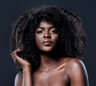Youre amazing, its time for you to own it. Studio shot of a beautiful young woman with glowing skin.