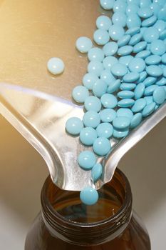 pour pills in bottle in medicine drug tablet in pharmacy