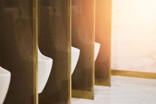 male potty in row in toilet of plumbling