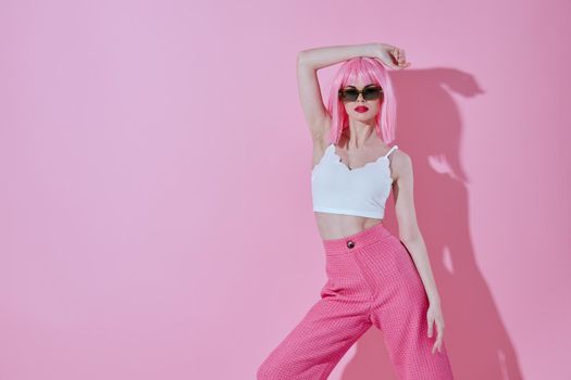 Beauty Fashion woman modern style pink hair Red lips fashion sunglasses color background unaltered. High quality photo